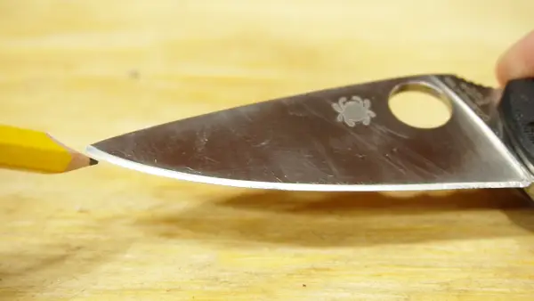 Why do curved knives require a different sharpening approach than straight knives